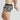 Model wears Retros Print Mens Trunk in SUMMER FOLIAGE PRINT. On body side view