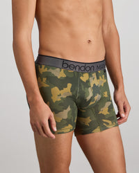 Model wears Everyday Active Mens Trunk in KOMBU CAMO. On body side view