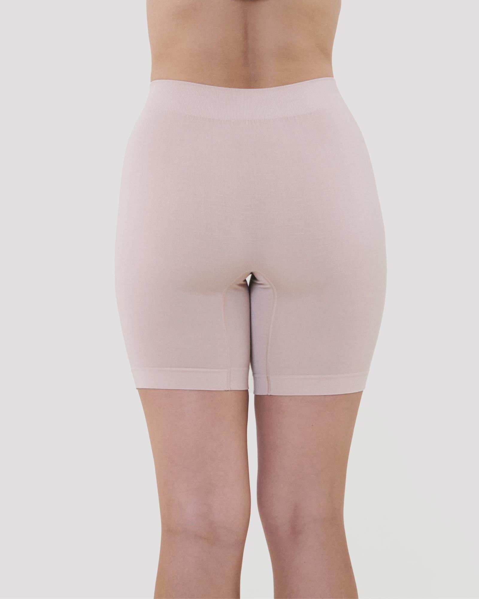 Model wears Smoothing Bodywear Chafer Short in CARAMEL. On body back view