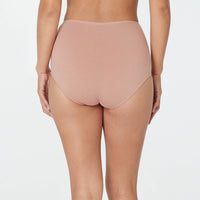 Model wears Freestyle Full Brief in COCOA. On body back view