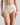 Model wears Freestyle Full Brief in CHAMPAGNE. On body front view