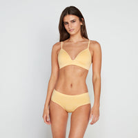 Model wears Simply Seamless Wire Free Bra in DAFFODIL MARL. On body front view