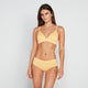 Model wears Simply Seamless Wire Free Bra in DAFFODIL MARL. On body front view