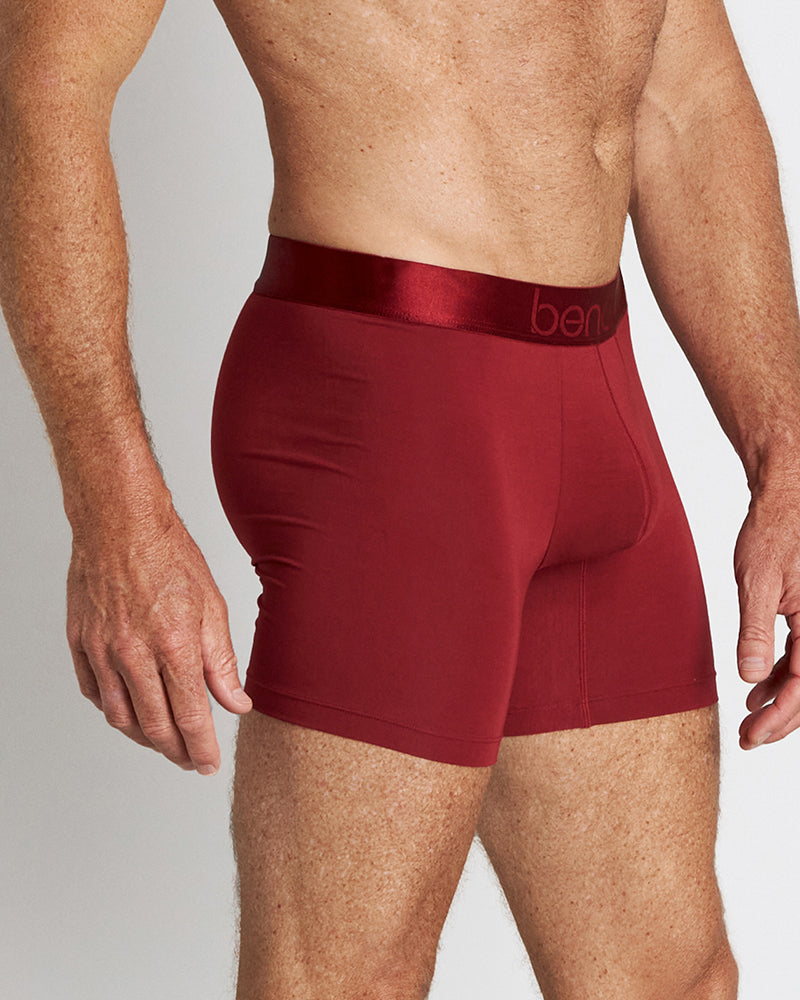 Model wears Bamboo Mens Trunk in BIKING RED. On body side view