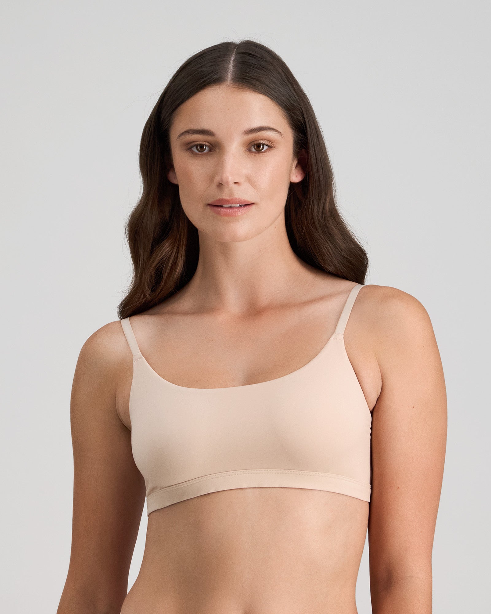 Model wears Extra-Ordinary Crop Top in LATTE. On body front view