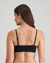 Model wears Extra-Ordinary Crop Top in BLACK. On body back view