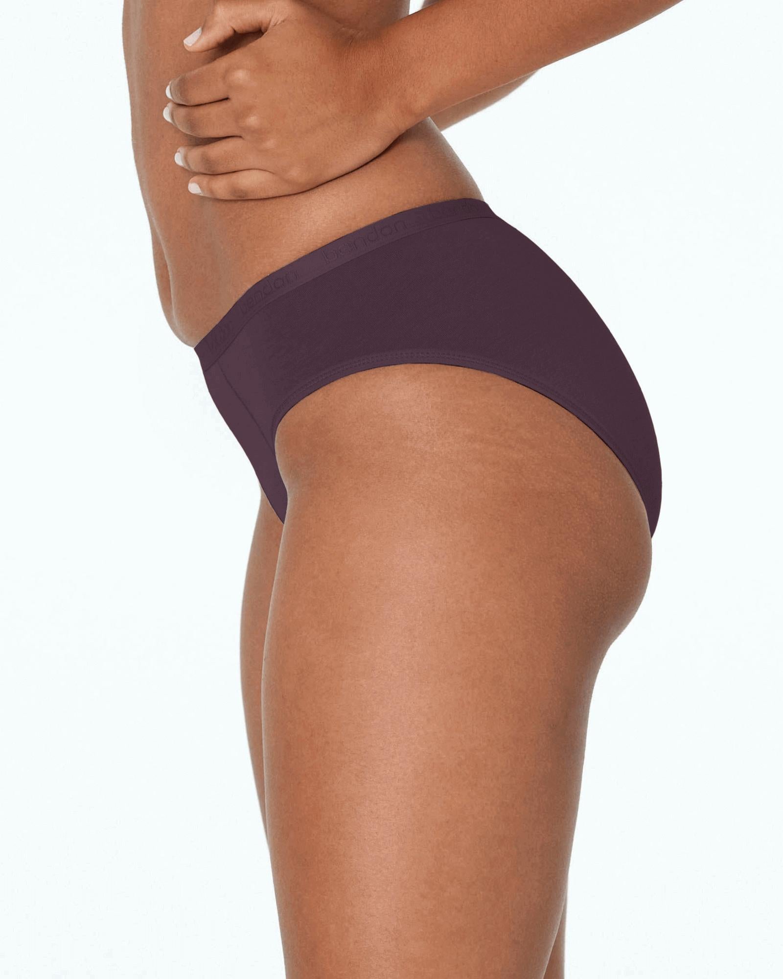 Model wears Body Cotton Bikini in PLUM PERFECT. On body side view