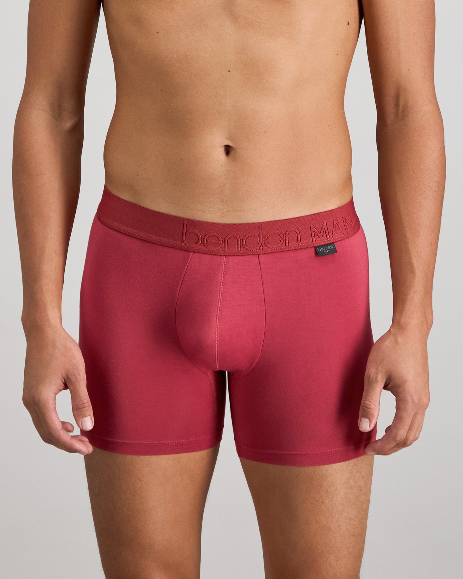 Model wears Bamboo Mens Trunk in GARNET. On body front view