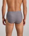Model wears Cotton Stretch Mens Brief in ASH PINSTRIPE. On body back view