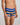 Model wears Rugby Stripe Mens Trunk in BLACK/SURF/OAK BUFF. On body side view