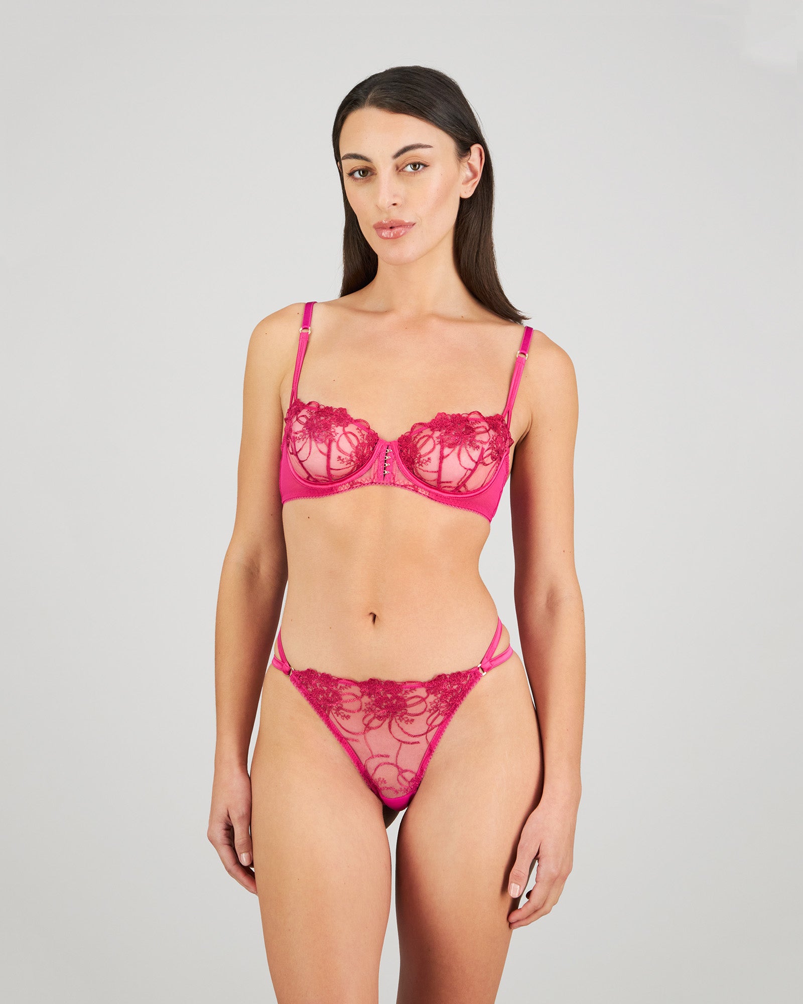 Heritage Bloom Thong in FANTASY FUCHSIA. Flat lay back view