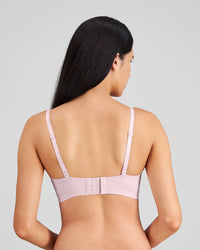 Model wears Comfit Collection Wire Free Bra in FESTIVAL BLOOM. On body back view