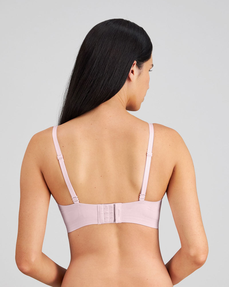 Model wears Comfit Collection Wire Free Bra in FESTIVAL BLOOM. On body back view