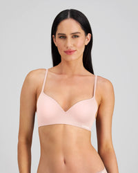 Model wears Simply Seamless Contour Bra in SILVER PINK. On body front view