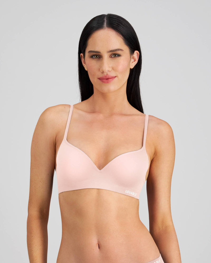 Model wears Simply Seamless Contour Bra in SILVER PINK. On body front view