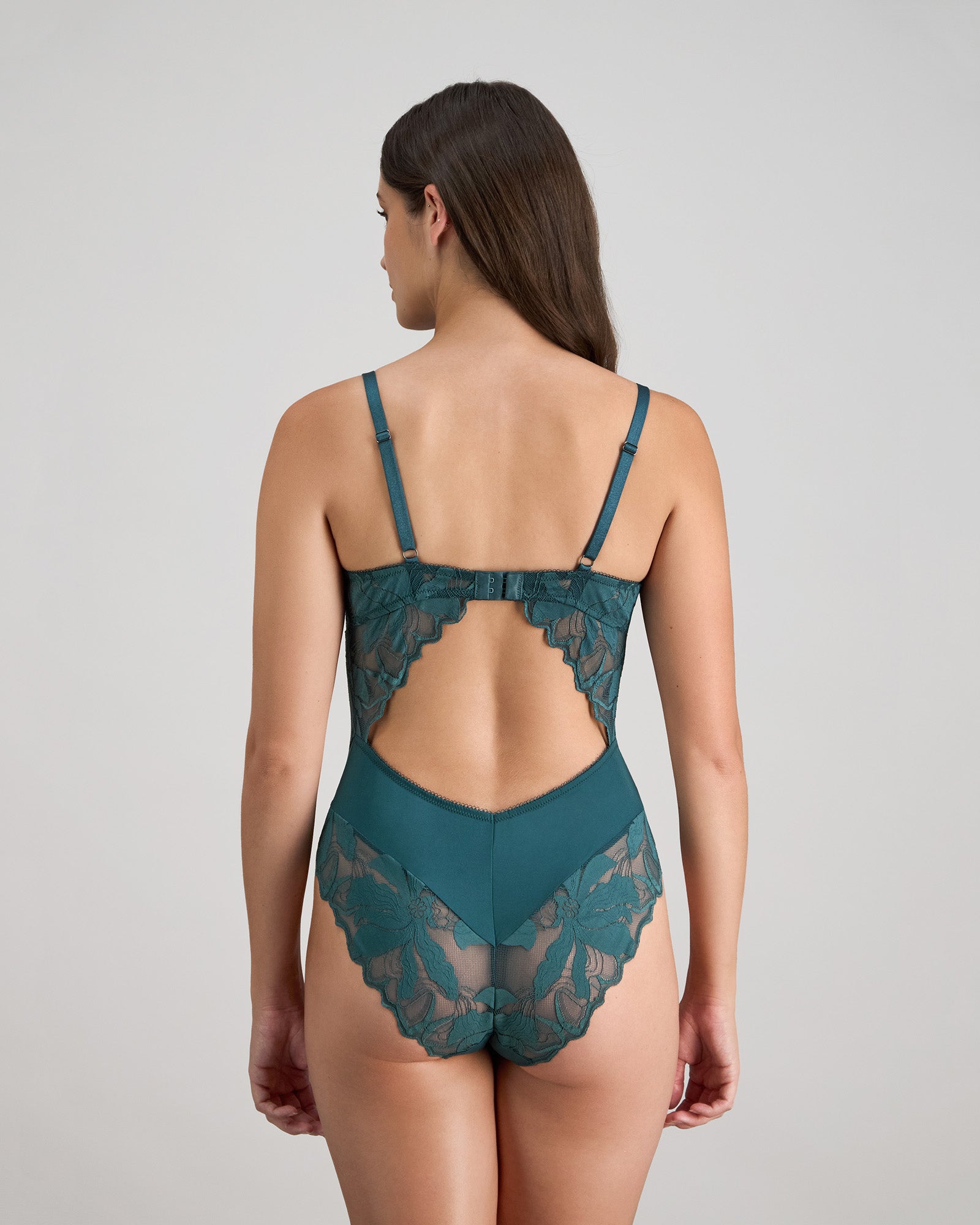 Model wears Margot Estelle Bodysuit in MEDITERRANEA. On body back view