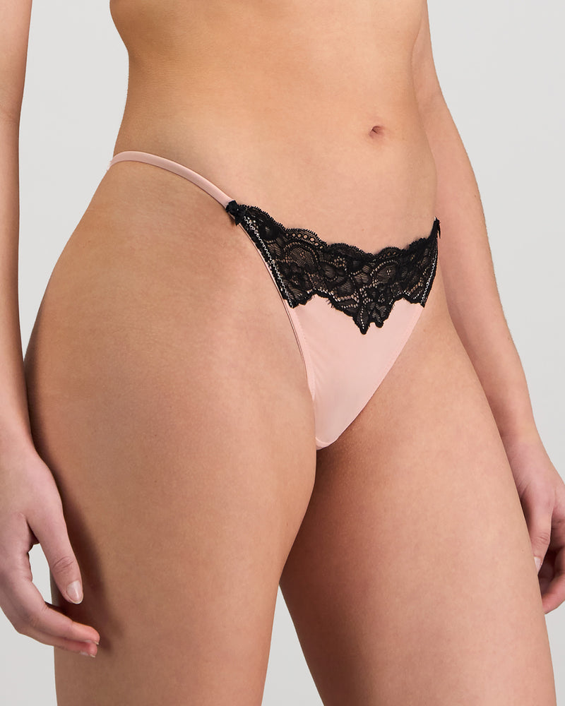 Model wears Aziza Thong in SILVER PINK/BLACK. On body side view