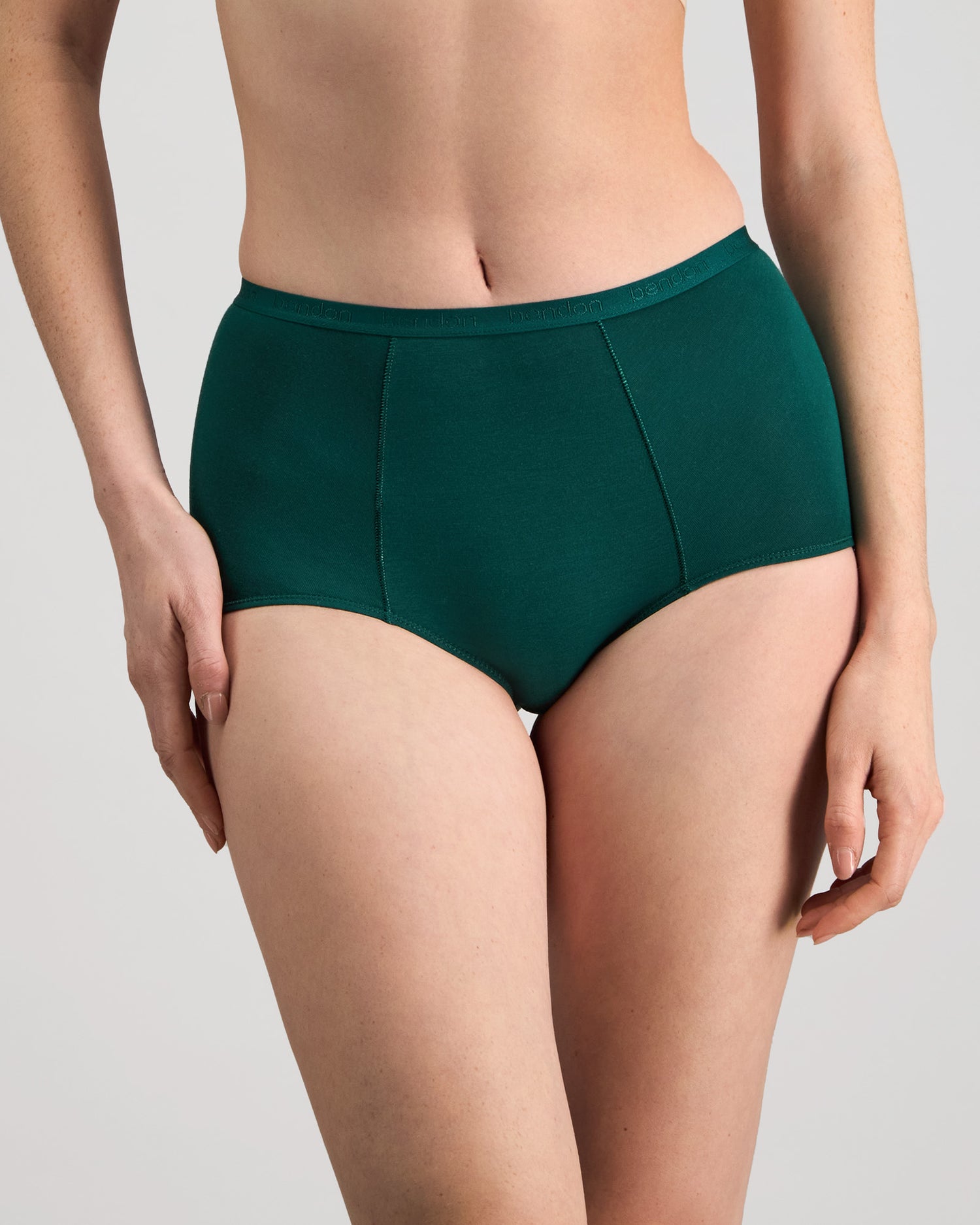 Model wears Body Cotton Full Brief in RAIN FOREST. On body front view