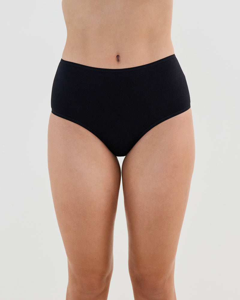 Model wears Cotton And Lace Full Brief in BLACK. On body front view