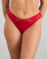 Model wears Margot Estelle Thong in JESTER RED. On body front view