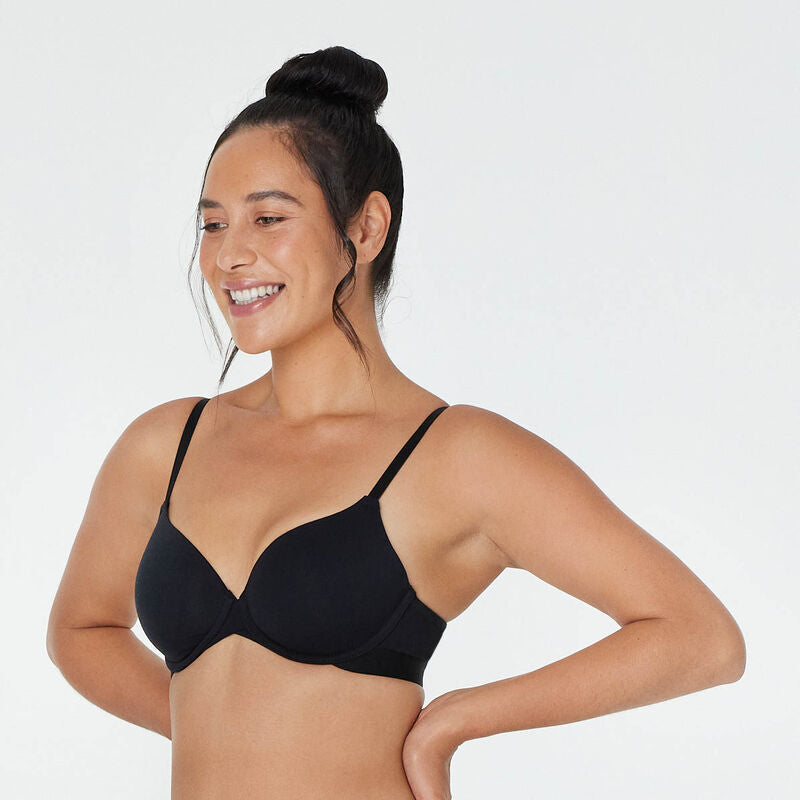 Model wears Body Cotton Contour Bra in BLACK. On body side view