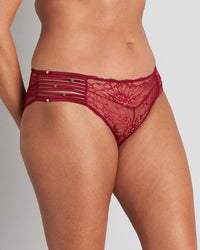 Model wears Fae Brazilian in BIKING RED. On body side view