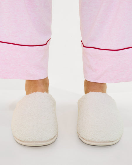 Model wears Teddy Slippers in CREAM. On body side view