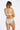 Model wears Rose Radiance Full Brief in WHITE. On body back view