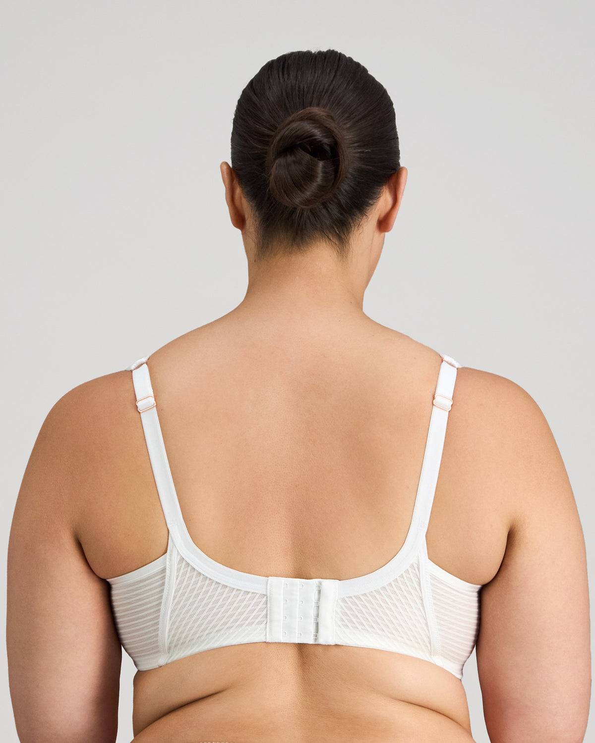 Model wears Perfect Lines Contour Bra in WHITE. On body back view