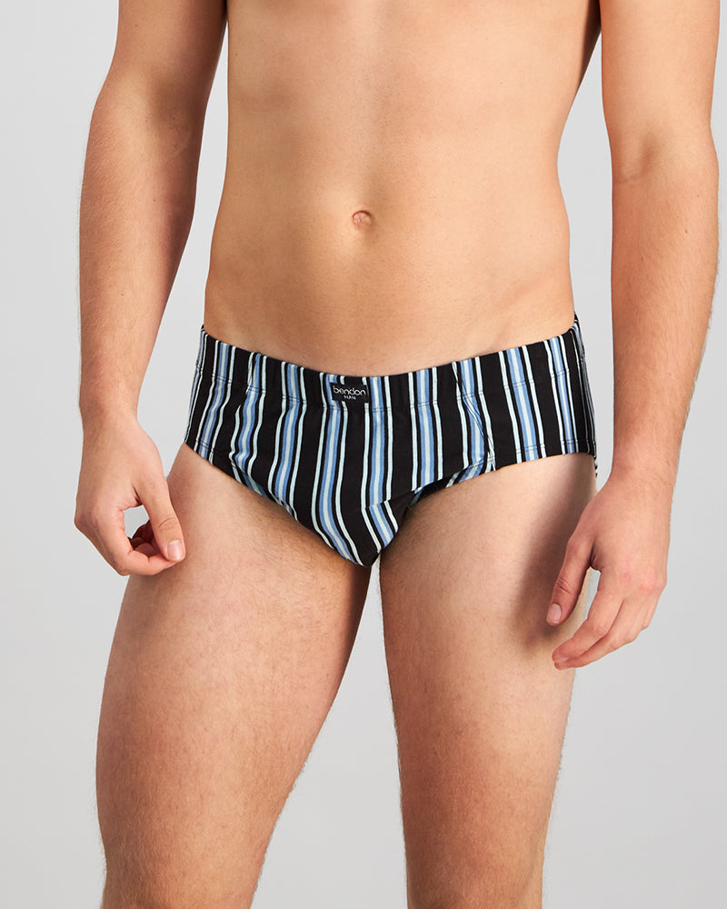 Model wears Cotton Stretch Mens Brief in AQUIFER/BLACK STRIPE. On body front view