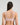 Model wears Perfect Lines Contour Bra in PALE LILAC. On body back view