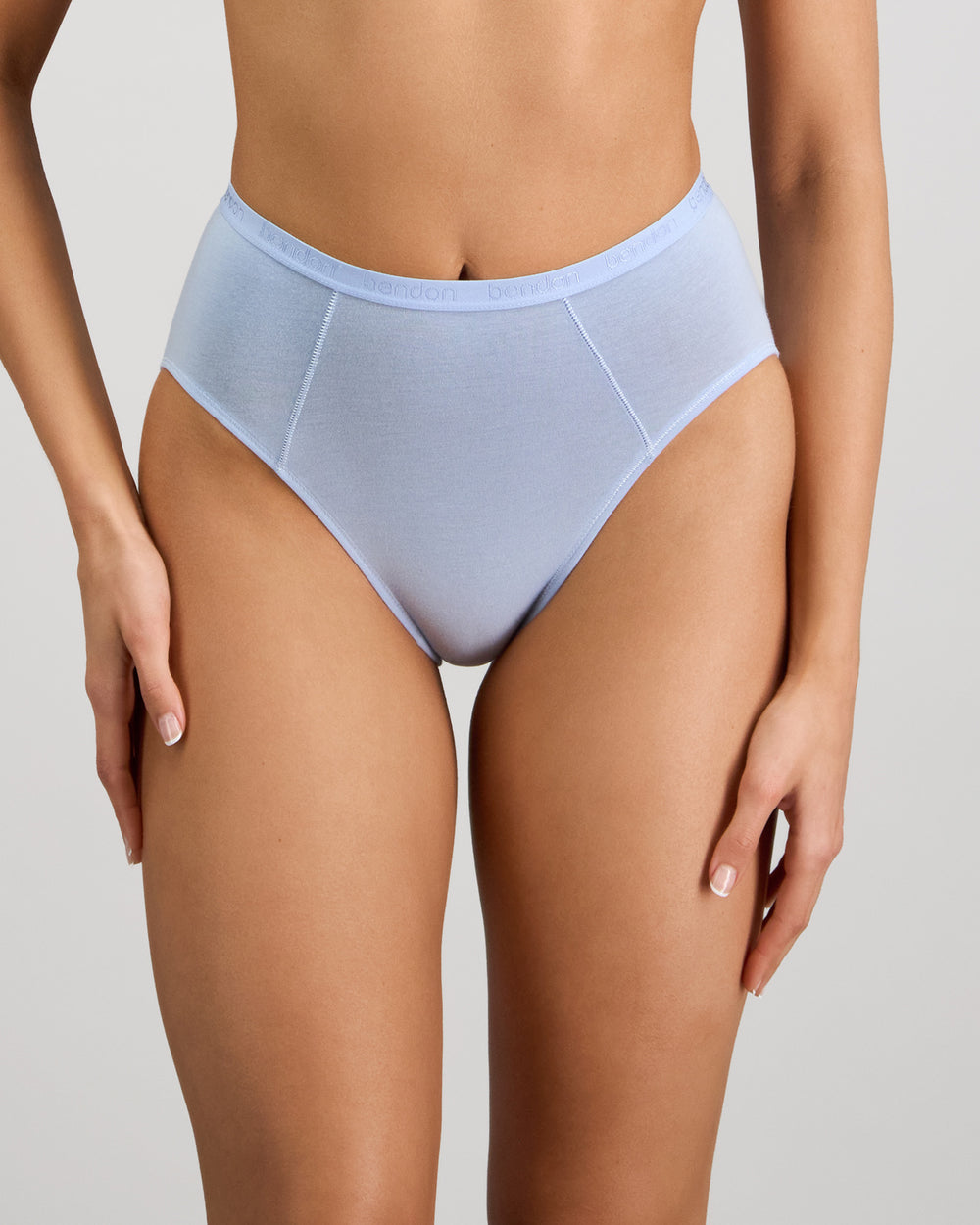 Model wears Body Cotton High Cut Brief in SKYWAY. On body front view