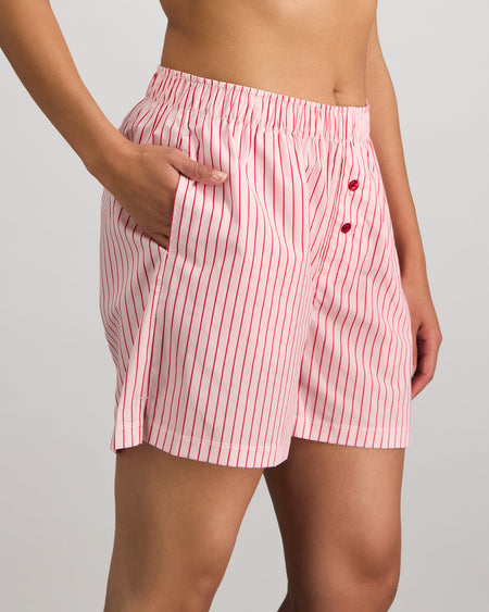 Model wears Cabana Stripe Boxer in CANDY CANE. On body side view