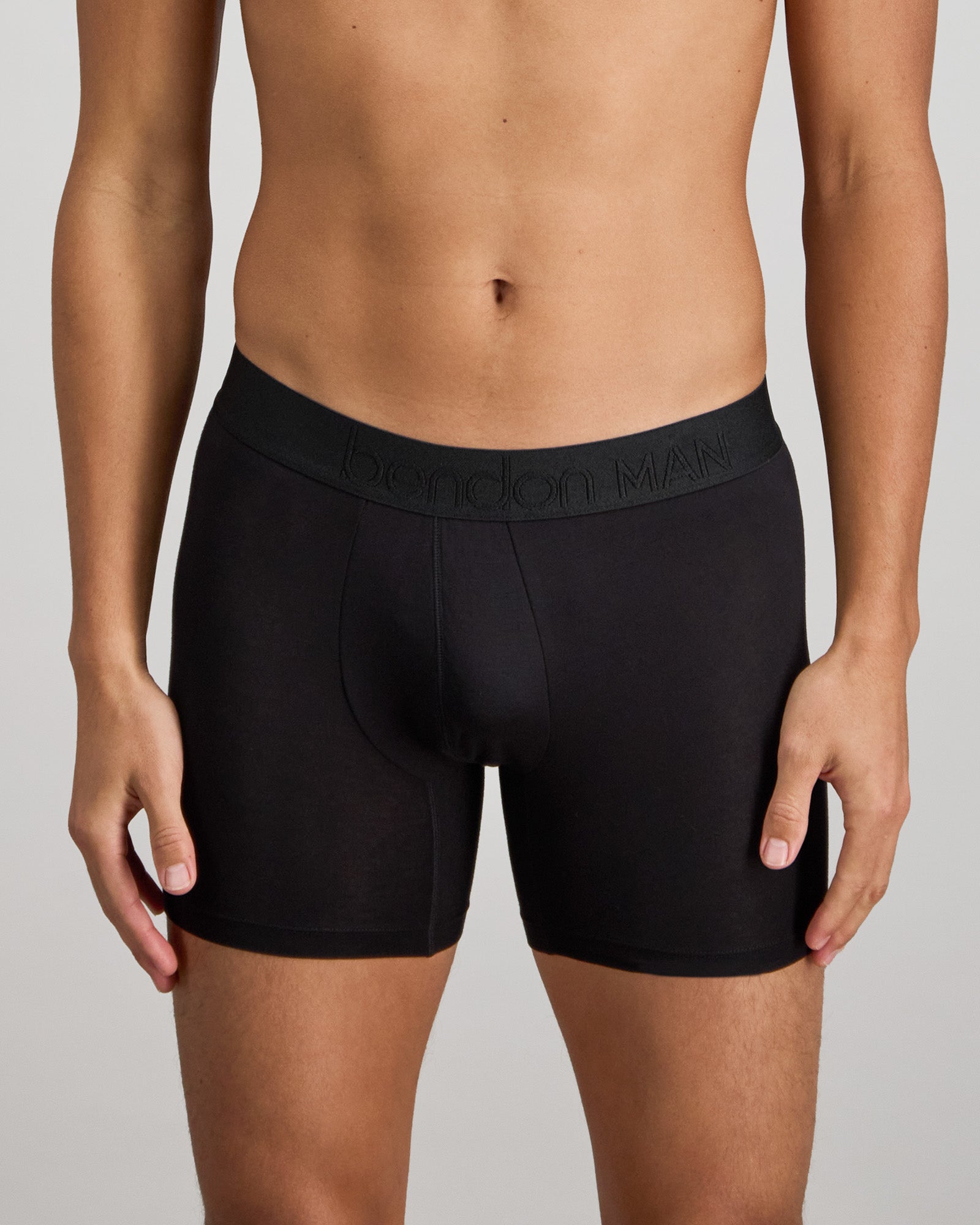 Model wears Bamboo Mens Trunk in BLACK. On body front view