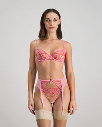 Model wears Josephine Suspender in SACHET PINK. On body front view