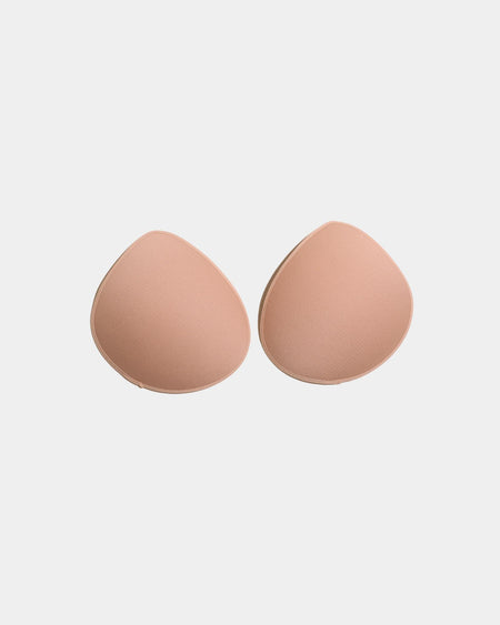 Model wears Reusable Nursing Pads in Nude. On body front view