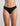 Model wears Extra-Ordinary Thong in BLACK. On body front view