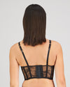 Model wears Scarlet Lover Corset in BLACK. On body back view