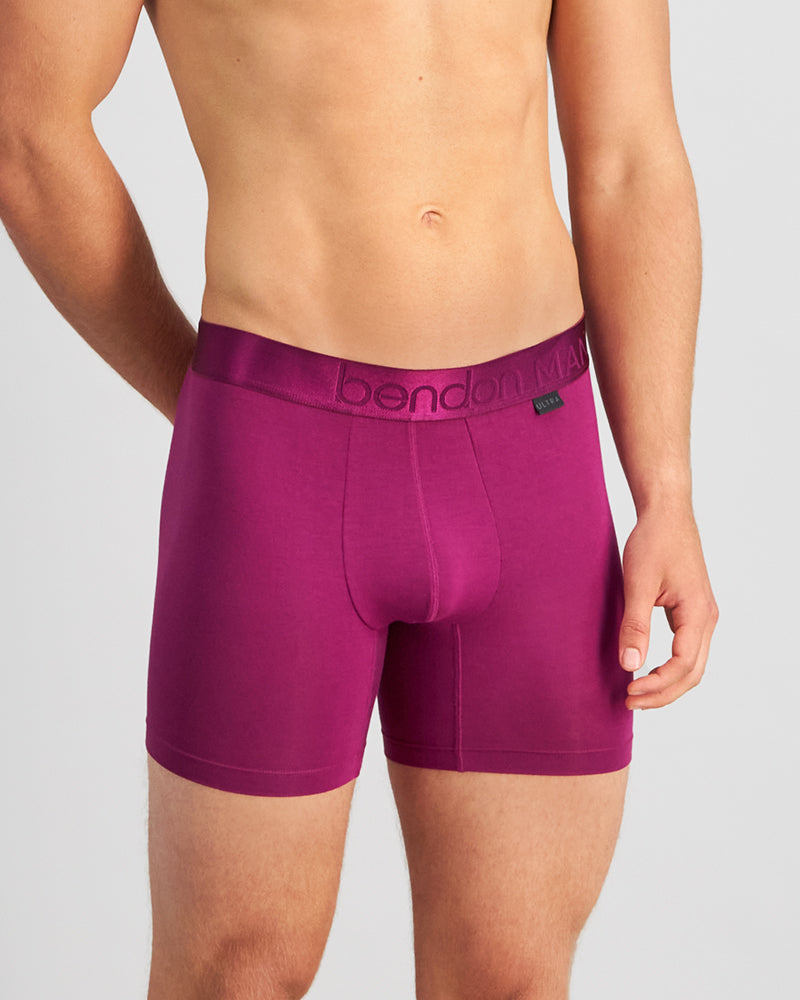 Model wears Bamboo Mens Trunk in MAGENTA PURPLE. On body front view
