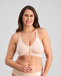 Model wears Bendon Restore Wire Free Front Opening Bra in LATTE. On body front view