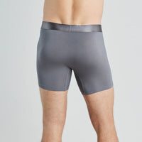 Model wears Bamboo Mens Trunk in ASH. On body back view