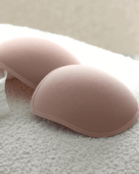 Reusable Nursing Pads in Nude. Flat lay front view