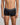 Model wears Cotton Low-Rise Mens Trunk in BLACK. On body front view
