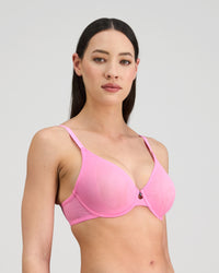 Model wears Lightweight Underwire Bra in BUBBLEGUM PINK. On body side view