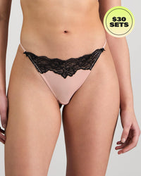 Model wears Aziza Thong in SILVER PINK/BLACK. On body front view