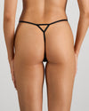 Model wears Midnight Magic Thong in BLACK. On body back view