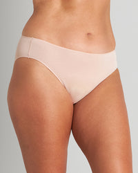Model wears Au Naturel High Cut Brief in LATTE. On body side view