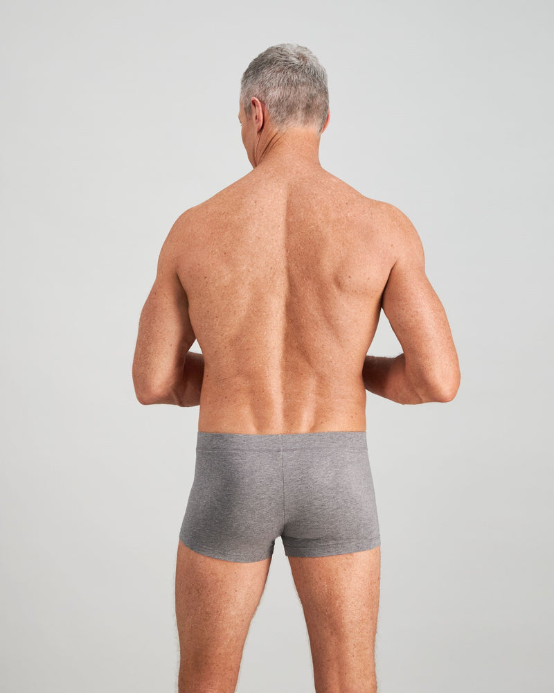Model wears High Tech Cotton Mens Trunk in GREY MARL. On body back view