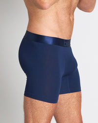 Model wears Bamboo Mens Trunk in Medieval Blue. On body side view