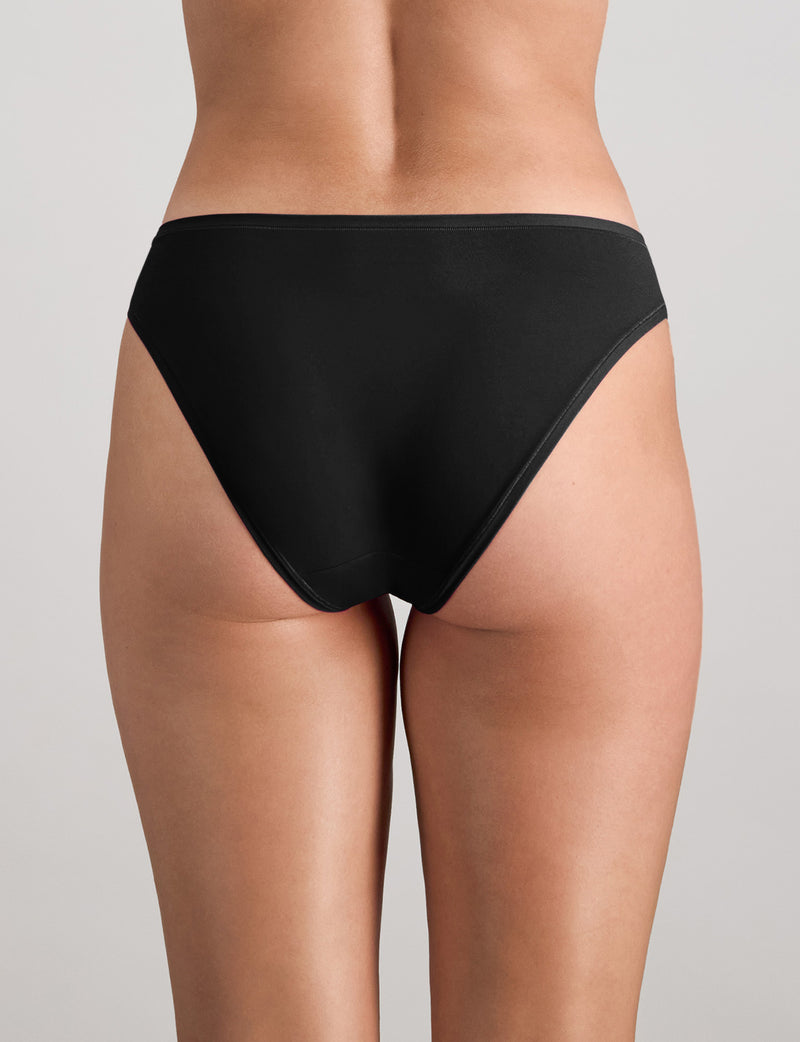 Model wears Extra-Ordinary Bikini Brief in BLACK. On body back view